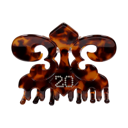 Irreplaceable tortoiseshell claw clip, angled detail of the fleur de lis shape and crystals