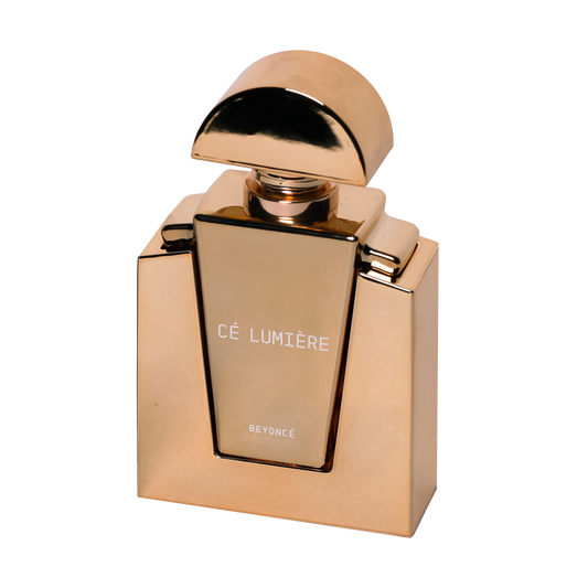 Cé Lumière gold perfume bottle with the domed cap lifted and the label facing forward