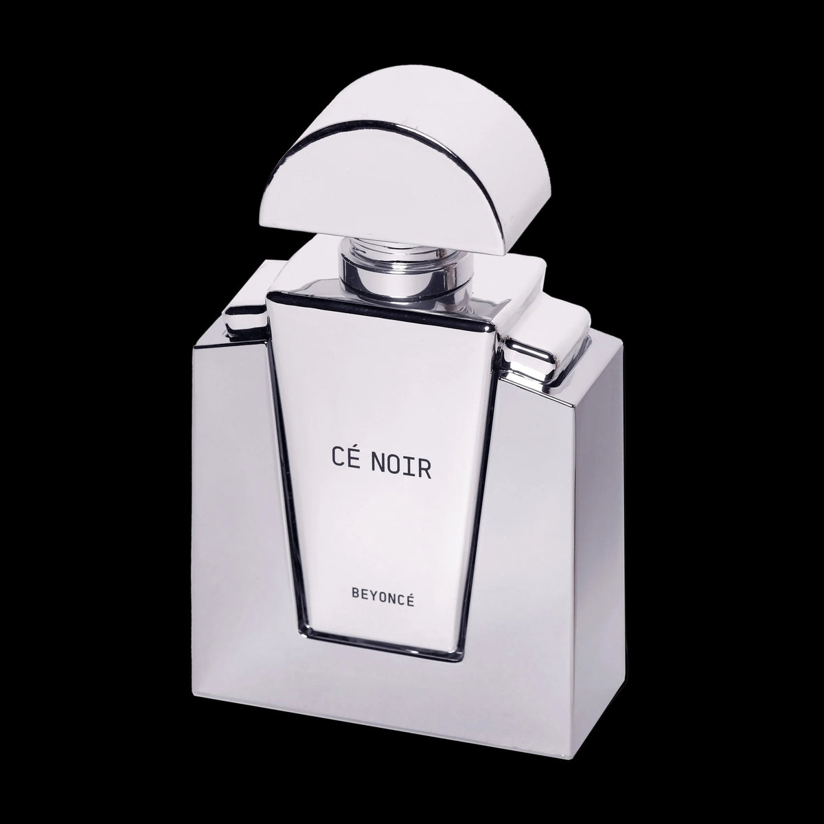 Cé Noir silver perfume bottle shown open against black, label facing forward