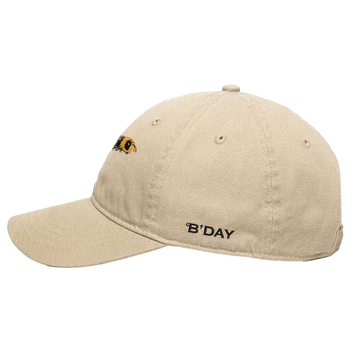 B'DAY cream Hive cotton cap, side view with B'DAY embroidered along the brim
