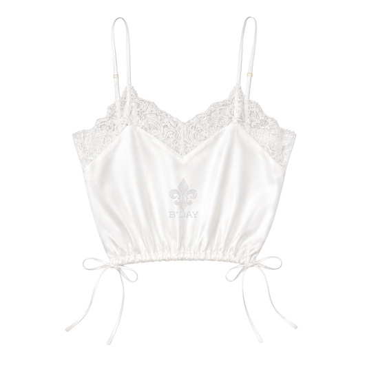 Beyoncé Déjà Vu cami in white, satin camisole with lace trim and drawstring side ties, front