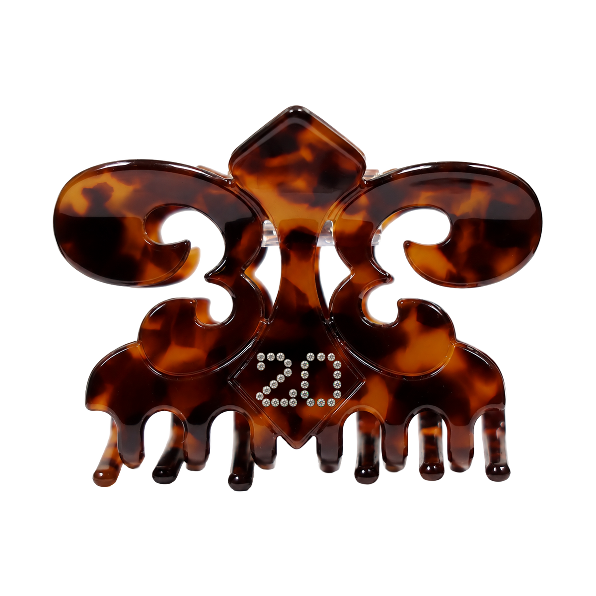 Irreplaceable tortoiseshell claw clip, angled detail of the fleur de lis shape and crystals